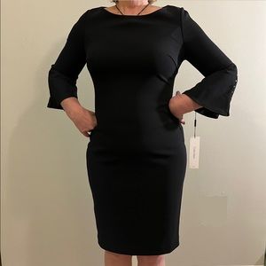Calvin Klein size 8, black bell sleeve dress with pearl details